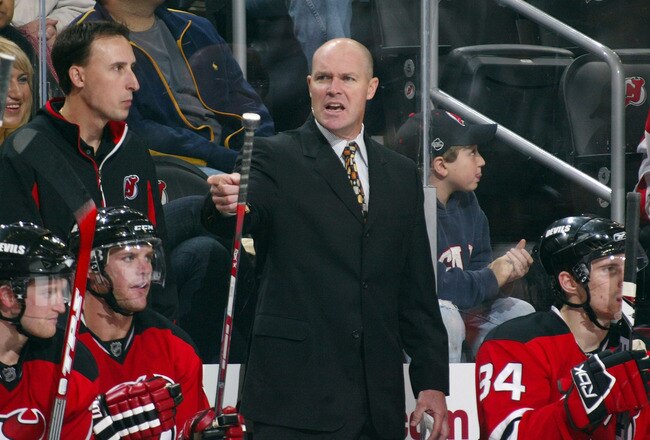 NEWARK, NJ - OCTOBER 04: Assistant Coach John MacLean of the New Jersey Devils gives players instructions in their game against the Philadelphia Flyers on October 4, 2008 at the Prudential Center in Newark, New Jersey. The Devils defeated the Flyers 3-2. (Photo by Bruce Bennett/Getty Images)