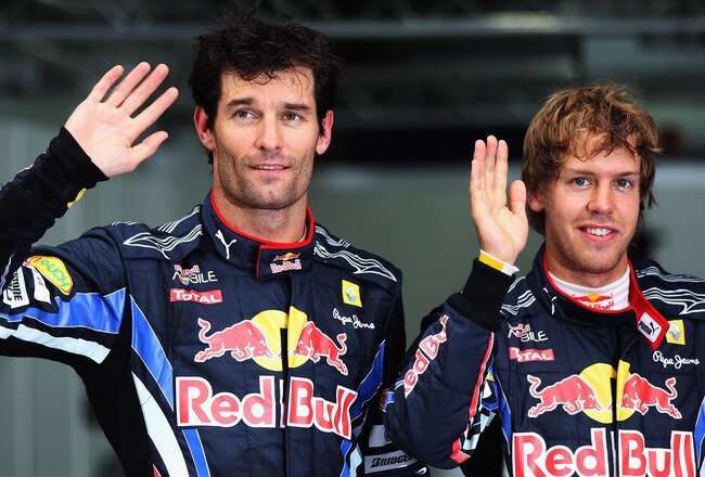 YEONGAM GUN, SOUTH KOREA - OCTOBER 23:  Pole sitter Sebastian Vettel (R) of Germany and Red Bull Racing celebrates in parc ferme with second placed Mark Webber (L) of Australia and Red Bull Racing following qualifying for the Korean Formula One Grand Prix at the Korea International Circuit on October 23, 2010 in Yeongam-gun, South Korea.  (Photo by Mark Thompson/Getty Images)