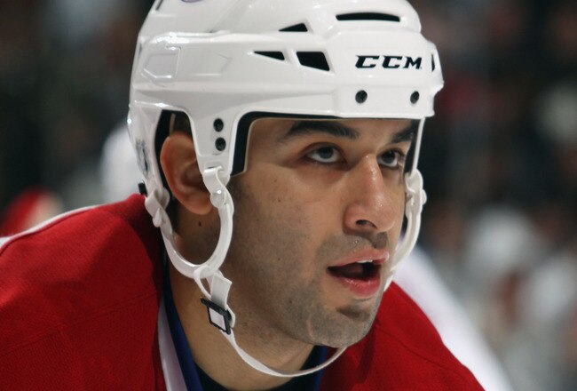 UNIONDALE, NY - OCTOBER 29:  Scott Gomez #11 of the Montreal Canadiens skates against the New York Islanders at the Nassau Coliseum on October 29, 2010 in Uniondale, New York.  (Photo by Bruce Bennett/Getty Images)