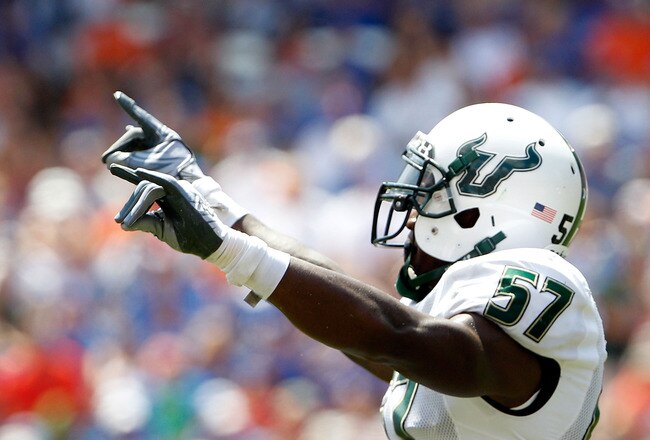 GAINESVILLE, FL - SEPTEMBER 11:  Jacquain Williams #57 of the South Florida Bulls celebrates during a game against the Florida Gators at Ben Hill Griffin Stadium on September 11, 2010 in Gainesville, Florida.  (Photo by Sam Greenwood/Getty Images)