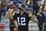 IOWA CITY, IA - OCTOBER 30- Quarterback Ricky Stanzi #12 of the University of Iowa Hawkeyes warms up his throwing arm before play against the Michigan State Spartans at Kinnick Stadium on October 30, 2010 in Iowa City, Iowa. Iowa won 37-6 over Michigan State. (Photo by David Purdy/Getty Images)