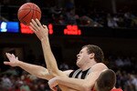JACKSONVILLE, FL - MARCH 19:  Keaton Nankivil #52 of the Wisconsin Badgers stops Noah Dahlman #42 of the Wofford Terriers during the first round of the 2010 NCAA men's basketball tournament at Jacksonville Veteran's Memorial Arena on March 19, 2010 in Jacksonville, Florida.  (Photo by Andy Lyons/Getty Images)