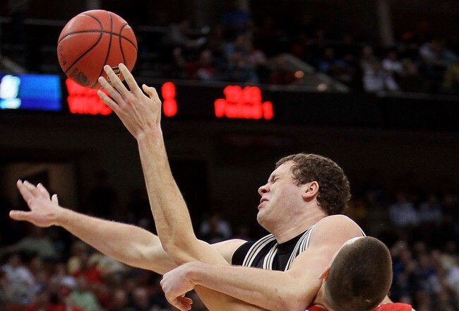 JACKSONVILLE, FL - MARCH 19:  Keaton Nankivil #52 of the Wisconsin Badgers stops Noah Dahlman #42 of the Wofford Terriers during the first round of the 2010 NCAA men's basketball tournament at Jacksonville Veteran's Memorial Arena on March 19, 2010 in Jacksonville, Florida.  (Photo by Andy Lyons/Getty Images)