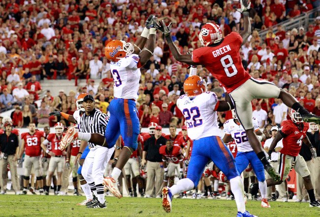 JACKSONVILLE, FL - OCTOBER 30:  A.J. Green #8 of the Georgia Bulldogs attempts to catch a pass against Jelani Jenkins #43 and Matt Elam #22 of the Florida Gators during the game at EverBank Field on October 30, 2010 in Jacksonville, Florida.  (Photo by Sam Greenwood/Getty Images)