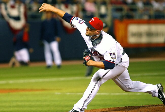 MINNEAPOLIS, MN - APRIL 6:  Jesse Crain #28 of the Minnesota Twins pitches against the Seattle Mariners on Opening Day at the Metrodome on April 6, 2009 in Minneapolis, Minnesota. (Photo by Scott A. Schneider/Getty Images)