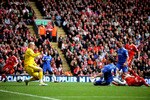 LIVERPOOL, ENGLAND - MAY 02:  Frank Lampard of Chelsea scores his team's second goal past Pepe Reina of Liverpool during the Barclays Premier League match between Liverpool and Chelsea at Anfield on May 2, 2010 in Liverpool, England.  (Photo by Laurence Griffiths/Getty Images)