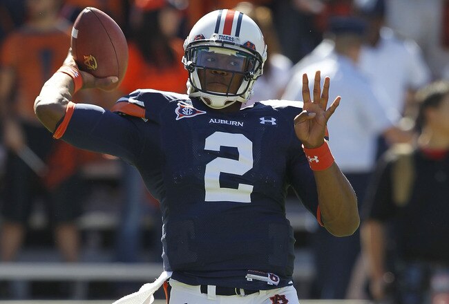 AUBURN, AL - OCTOBER 16:  Quarterback Cam Newton #2 of the Auburn Tigers throws a practice pass before the game against the Arkansas Razorbacks at Jordan-Hare Stadium on October 16, 2010 in Auburn, Alabama.  (Photo by Mike Zarrilli/Getty Images)