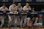 ARLINGTON, TX - OCTOBER 22:  (2nd from L-R) Kerry Wood #39, Mariano Rivera #42, Derek Jeter #2, and Andy Pettitte #46 of the New York Yankees look on from the dugout during Game Six of the ALCS against the Texas Rangers during the 2010 MLB Playoffs at Rangers Ballpark in Arlington on October 22, 2010 in Arlington, Texas.  (Photo by Ronald Martinez/Getty Images)