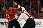 CHICAGO - NOVEMBER 03: Jack Dowell #28 of the Chicago Blackhawks fights with Adam Mair #10 of the New Jersey Devils at the United Center on November 3, 2010 in Chicago, Illinois. (Photo by Jonathan Daniel/Getty Images)