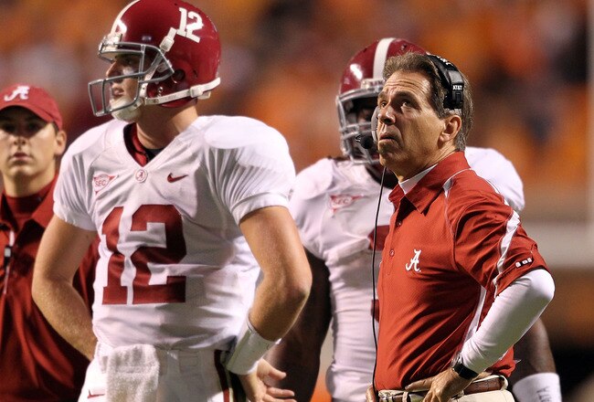 KNOXVILLE, TN - OCTOBER 23: Greg McElroy #12 and Nick Saban the Head Coach of the Alabama Crimson Tide are pictured during a timeout in the SEC game against the Tennessee Volunteers at Neyland Stadium on October 23, 2010 in Knoxville, Tennessee.  (Photo by Andy Lyons/Getty Images)