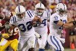 LANDOVER, MD - OCTOBER 17:  Running back Mike Hart #32 of the Indianapolis Colts is tackled by London Fletcher #59 of the Washington Redskins at FedEx Field on October 17, 2010 in Landover, Maryland. The Colts won the game 27-24.  (Photo by Win McNamee/Getty Images)