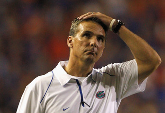 GAINESVILLE, FL - OCTOBER 09:  Head coach Urban Meyer of the Florida Gators puts his hand on his head during the game against the Louisiana State University Tigers at Ben Hill Griffin Stadium on October 9, 2010 in Gainesville, Florida.  (Photo by Sam Greenwood/Getty Images)
