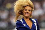 ARLINGTON, TX - OCTOBER 31:  A Dallas Cowboys cheerleader performs at Cowboys Stadium on October 31, 2010 in Arlington, Texas.  (Photo by Stephen Dunn/Getty Images)