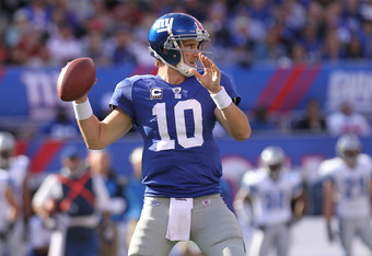 EAST RUTHERFORD, NJ - OCTOBER 17:  Eli Manning #10 of the New York Giants passes against the Detroit Lions at New Meadowlands Stadium on October 17, 2010 in East Rutherford, New Jersey.  (Photo by Nick Laham/Getty Images)