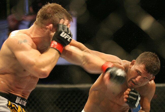 CHICAGO- OCTOBER 25: Sean Sherk (L) punches Tyson Griffin in a Lightweight bout at UFC's Ultimate Fight Night at Allstate Arena on October 25, 2008 in Chicago, Illinois. (Photo by Tasos Katopodis/Getty Images)