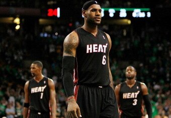 BOSTON, MA - OCTOBER 26: LeBron James #6, Chris Bosh #1 and Dwyane Wade #3 of the Miami Heat walk into position moments before losing to the Boston Celtics, 88-80, at the TD Banknorth Garden on October 26, 2010 in Boston, Massachusetts. NOTE TO USER: User expressly acknowledges and agrees that, by downloading and or using this photograph, User is consenting to the terms and conditions of the Getty Images License Agreement.  (Photo by Jim Rogash/Getty Images)
