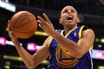 PHOENIX - OCTOBER 19:  Stephen Curry #30 of the Golden State Warriors drives to the basket during the preseason NBA game against the Phoenix Suns at US Airways Center on October 19, 2010 in Phoenix, Arizona. NOTE TO USER: User expressly acknowledges and agrees that, by downloading and or using this photograph, User is consenting to the terms and conditions of the Getty Images License Agreement.  (Photo by Christian Petersen/Getty Images)