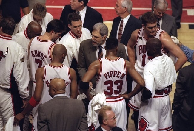 7 Jun 1998:  Coach Phil Jackson talks with Tony Kukoc, Jud Buechler, Luc Longley, Michael Jordan #23, Scottie Pippen #33, and Ron Harper of the Chicago Bulls during the NBA Finals Game 3 against the Utah Jazz at the United Center in Chicago, Illinois.  The Bulls defeated the Jazz 96-54. Mandatory Credit: Jonathan Daniel  /Allsport