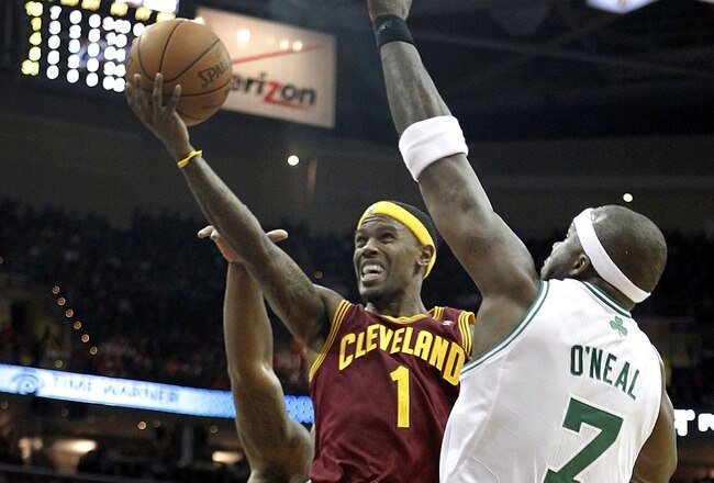 CLEVELAND - OCTOBER 27: Daniel Gibson #1 of the Cleveland Cavaliers tries to get a shot off around Jermaine O'Neal #7 of the Boston Celtics at Quicken Loans Arena on October 27, 2010 in Cleveland, Ohio. Cleveland won the game 95-87.  (Photo by Gregory Shamus/Getty Images)