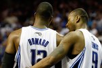 ORLANDO, FL - MAY 18:  (L-R) Dwight Howard #12 and Rashard Lewis #9 of the Orlando Magic talk against the Boston Celtics in Game Two of the Eastern Conference Finals during the 2010 NBA Playoffs at Amway Arena on May 18, 2010 in Orlando, Florida.  NOTE TO USER: User expressly acknowledges and agrees that, by downloading and/or using this Photograph, user is consenting to the terms and conditions of the Getty Images License Agreement.  (Photo by Doug Benc/Getty Images)