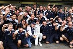 SAO PAULO, BRAZIL - NOVEMBER 06:  Nico Huelkenberg (centre white) of Germany and Williams celebrates in the paddock with team mates after finishing first during qualifying for the Brazilian Formula One Grand Prix at the Interlagos Circuit on November 6, 2010 in Sao Paulo, Brazil.  (Photo by Mark Thompson/Getty Images)