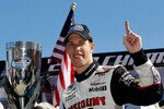 FORT WORTH, TX - NOVEMBER 06:  Brad Keselowski, driver of the #22 Discount Tire Dodge, celebrates after winning the Nationwide Championship with a third-place finish in the NASCAR Nationwide Series O'Reilly Auto Parts Challenge at Texas Motor Speedway on November 6, 2010 in Fort Worth, Texas.  (Photo by Tom Pennington/Getty Images for NASCAR)