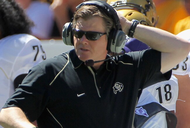DENVER - SEPTEMBER 04:  Head coach Dan Hawkins of the Colorado Buffaloes leads his team against the Colorado State Rams in the Rocky Mountain Showdown at INVESCO Field at Mile High on September 4, 2010 in Denver, Colorado. Colorado was awarded the Centenial Trophy after they defeated Colorado State 24-3.  (Photo by Doug Pensinger/Getty Images)