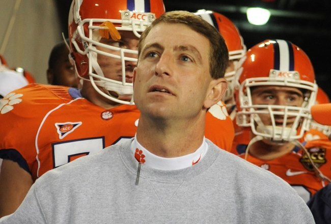 TAMPA, FL - NOVEMBER 28: Coach Dabo Swinney of the Clemson Tigers checks the scoreboard before play against the Georgia Tech Yellow Jackets in the 2009 ACC Football Championship Game December 5, 2009 at Raymond James Stadium in Tampa, Florida.  (Photo by Al Messerschmidt/Getty Images)