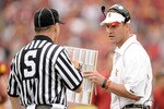 LOS ANGELES, CA - OCTOBER 16:  Head Coach Lane Kiffin of the USC Trojans argues a call with an official against the California Golden Bears at Los Angeles Memorial Coliseum on October 16, 2010 in Los Angeles, California.  (Photo by Harry How/Getty Images)