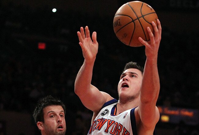 NEW YORK - MARCH 19:  Danilo Gallinari #8 of the New York Knicks lays the ball up against Jason Kapono #72 of the Philadelphia 76ers at Madison Square Garden on March 19, 2010 in New York City. NOTE TO USER: User expressly acknowledges and agrees that, by downloading and or using this photograph, User is consenting to the terms and conditions of the Getty Images License Agreement.  (Photo by Nick Laham/Getty Images)