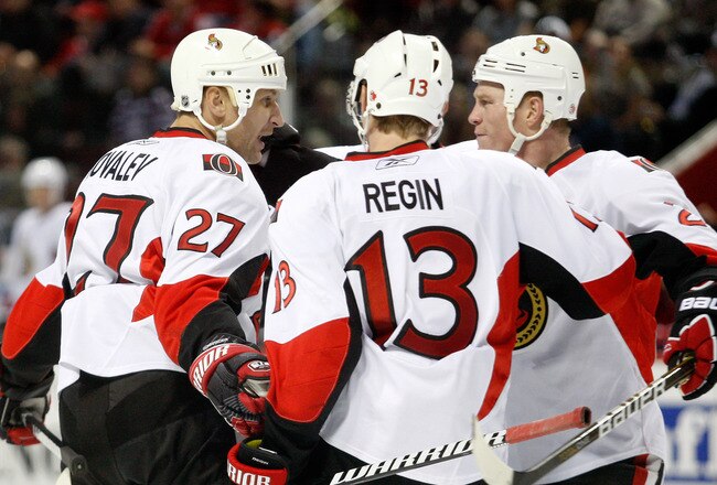MONTREAL- NOVEMBER 6:  Alexei Kovalev #27 of the Ottawa Senators celebrates his third period goal with teammates Chris Neil #25 and Peter Regin #13 during the NHL game against the Montreal Canadiens at the Bell Centre on November 6, 2010 in Montreal, Quebec, Canada.  The Senators defeated the Canadiens 3-2.  (Photo by Richard Wolowicz/Getty Images)