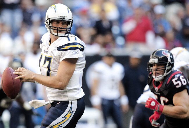 HOUSTON - NOVEMBER 07:  Quarterback Philip Rivers #17 of the San Diego Chargers looks for a receiver as linebacker Brian Cushing #56 of the Houston Texans applies pressure at Reliant Stadium on November 7, 2010 in Houston, Texas.  (Photo by Bob Levey/Getty Images)
