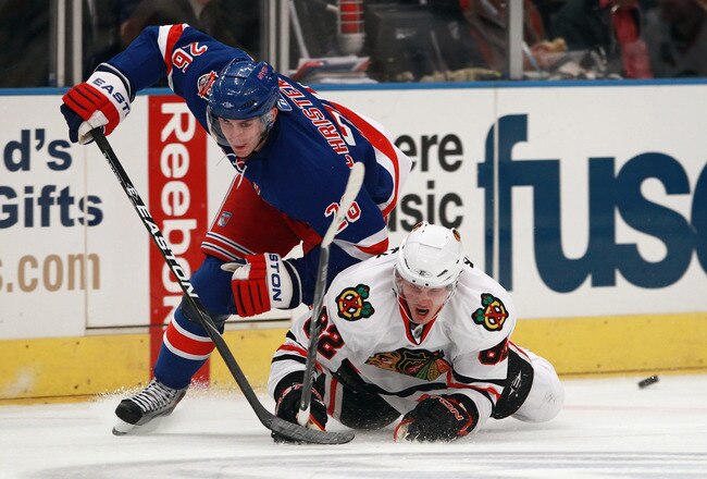 NEW YORK - NOVEMBER 01:  Tomas Kopecky #82 of the Chicago Blackhawks and Erik Christensen #26 of the New York Rangers battle for the puck at Madison Square Garden on November 1, 2010 in New York City.  (Photo by Bruce Bennett/Getty Images)