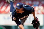 ST. LOUIS - AUGUST 18: Relief pitcher John Axford #59 of the Milwaukee Brewers throws against the St. Louis Cardinals at Busch Stadium on August 18, 2010 in St. Louis, Missouri.  The Brewers beat the Cardinals 3-2.  (Photo by Dilip Vishwanat/Getty Images)