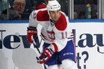 UNIONDALE, NY - OCTOBER 29:  Scott Gomez #11 of the Montreal Canadiens skates against the New York Islanders at the Nassau Coliseum on October 29, 2010 in Uniondale, New York.  (Photo by Bruce Bennett/Getty Images)