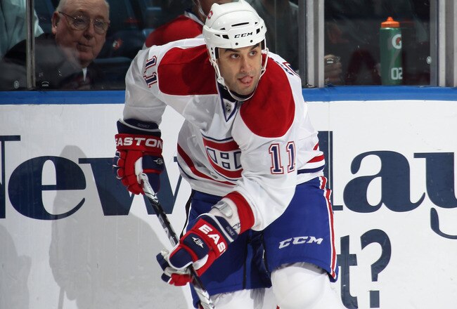UNIONDALE, NY - OCTOBER 29:  Scott Gomez #11 of the Montreal Canadiens skates against the New York Islanders at the Nassau Coliseum on October 29, 2010 in Uniondale, New York.  (Photo by Bruce Bennett/Getty Images)