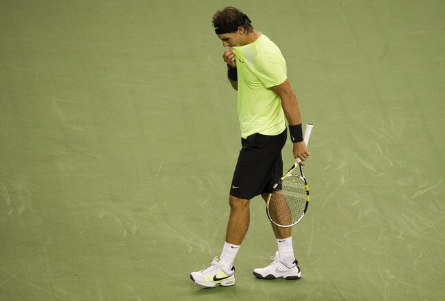 SHANGHAI, CHINA - OCTOBER 14:  Rafael Nadal of Spain reacts after loosing a point against Jurgen Melzer of Austria during day four of the 2010 Shanghai Rolex Masters at the Shanghai Qi Zhong Tennis Center on October 14, 2010 in Shanghai, China.  (Photo by Victor Fraile/Getty Images)