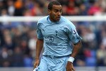 BOLTON, ENGLAND - NOVEMBER 06: Tom Huddlestone of Tottenham Hotspur in action during the Barclays Premier League match between Bolton Wanderers and Tottenham Hotspur at the Reebok Stadium on November 6, 2010 in Bolton, England.  (Photo by Clive Brunskill/Getty Images)