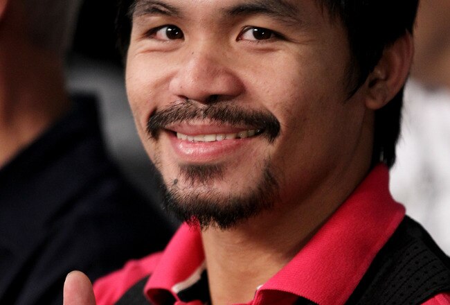 NEW YORK - JUNE 05:  Professional boxer Manny Pacquiao watches the bout between Yuri Foreman and Miguel Cotto of Puerto Rico in the WBA world super welterweight title fight on June 5, 2010 at Yankee Stadium in the Bronx borough of New York City. Cotto wins by TKO in the ninth round. (Photo by Al Bello/Getty Images)