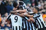LONDON, ENGLAND - NOVEMBER 07:  Andy Carroll of Newcastle is mobbed by team mates after scoring during the Barclays Premier League match between Arsenal and Newcastle United at the Emirates Stadium on November 7, 2010 in London, England.  (Photo by Mike Hewitt/Getty Images)