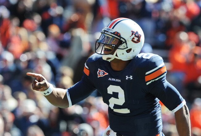 AUBURN, AL - NOVEMBER 6:  Quarterback Cam Newton #2 of the Auburn Tigers celebrates a touchdown run against the Chattanooga Mocs November 6, 2010 at Jordan-Hare Stadium in Auburn, Alabama.  (Photo by Al Messerschmidt/Getty Images)