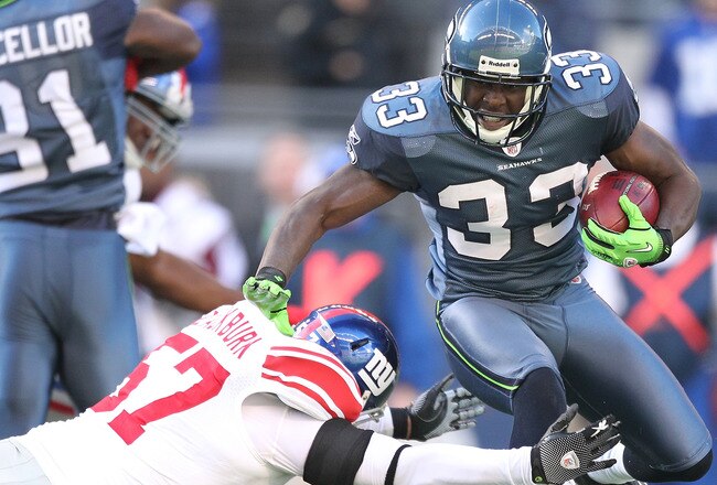 SEATTLE - NOVEMBER 07:  Leon Washington #33 of the Seattle Seahawks is tackled on a kick return by Chase Blackburn #57 of the New York Giants at Qwest Field on November 7, 2010 in Seattle, Washington. The Giants defeated the Seahawks 41-7. (Photo by Otto Greule Jr/Getty Images)