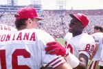 27 Jul 1991:  Quarterback Joe Montana and wide receiver Jerry Rice of the San Francisco 49ers talk to each other during a preseason game against the Los Angeles Raiders.  The 49ers won the game 24-17. Mandatory Credit: Stephen Dunn  /Allsport