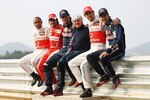 YEONGAM-GUN, SOUTH KOREA - OCTOBER 21:   (L-R) F1 World Championship contenders Lewis Hamilton of Great Britain and McLaren Mercedes, Fernando Alonso of Spain and Ferrari, Mark Webber of Australia and Red Bull Racing, F1 supremo Bernie Ecclestone, Jenson Button of Great Britain and McLaren Mercedes and Sebastian Vettel of Germany and Red Bull Racing pose for a photograph during previews to the Korean Formula One Grand Prix at the Korea International Circuit on October 21, 2010 in Yeongam-gun, South Korea.  (Photo by Paul Gilham/Getty Images)