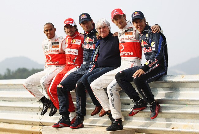 YEONGAM-GUN, SOUTH KOREA - OCTOBER 21:   (L-R) F1 World Championship contenders Lewis Hamilton of Great Britain and McLaren Mercedes, Fernando Alonso of Spain and Ferrari, Mark Webber of Australia and Red Bull Racing, F1 supremo Bernie Ecclestone, Jenson Button of Great Britain and McLaren Mercedes and Sebastian Vettel of Germany and Red Bull Racing pose for a photograph during previews to the Korean Formula One Grand Prix at the Korea International Circuit on October 21, 2010 in Yeongam-gun, South Korea.  (Photo by Paul Gilham/Getty Images)