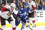 TORONTO - NOVEMBER 2:  Phil Kessel #81 of the Toronto Maple Leafs tracks Chris Phillips #4 of the Ottawa Senators during NHL action at the Air Canada Centre November 2, 2010 in Toronto, Ontario, Canada. (Photo by Abelimages/Getty Images)