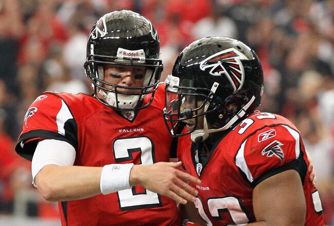 ATLANTA - NOVEMBER 07:  Quarterback Matt Ryan #2 of the Atlanta Falcons celebrates with Michael Turner #33 after Turner's touchdown against the Tampa Bay Buccaneers at Georgia Dome on November 7, 2010 in Atlanta, Georgia.  (Photo by Kevin C. Cox/Getty Images)