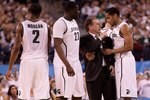 INDIANAPOLIS - APRIL 03:  Head coach Tom Izzo of the Michigan State Spartans talks with Chris Allen #3 from the sideline while taking on the Butler Bulldogs during the National Semifinal game of the 2010 NCAA Division I Men's Basketball Championship on April 3, 2010 in Indianapolis, Indiana.  (Photo by Andy Lyons/Getty Images)