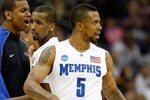 KANSAS CITY, MO - MARCH 21:   (L-R) Wesley Witherspoon #11 of the Memphis Tigers encourages teammate Doneal Mack #20 as he comes to the bench while teammate Antonio Anderson #5 looks on during their second round game against the Maryland Terrapins in the NCAA Division I Men's Basketball Tournament at the Sprint Center on March 21, 2009 in Kansas City, Missouri.  The Tigers defeatd the Terrapins 89-70. (Photo by Jamie Squire/Getty Images)