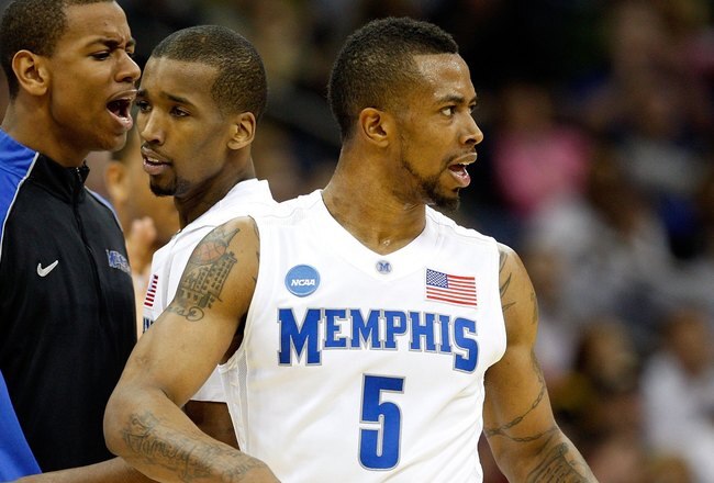 KANSAS CITY, MO - MARCH 21:   (L-R) Wesley Witherspoon #11 of the Memphis Tigers encourages teammate Doneal Mack #20 as he comes to the bench while teammate Antonio Anderson #5 looks on during their second round game against the Maryland Terrapins in the NCAA Division I Men's Basketball Tournament at the Sprint Center on March 21, 2009 in Kansas City, Missouri.  The Tigers defeatd the Terrapins 89-70. (Photo by Jamie Squire/Getty Images)